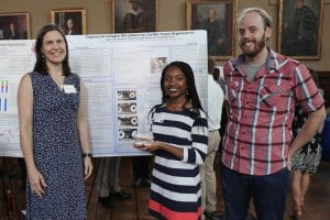 PI, undergraduate, and graduate student at poster