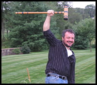 Lab member holds up croquet mallet