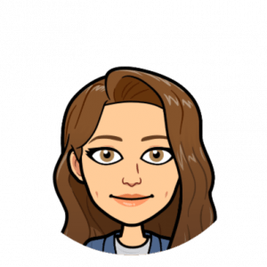 Image Description: This is a Bitmoji of Shaina. She has long brown hair, light brown eyes, white skin, and is wearing a blue blazer with a grey shirt underneath.