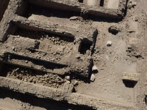 bird's-eye photograph of ruined mudbrick walls